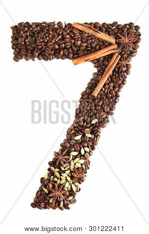 Number 7 From Coffee Beans And Species Isolated On White Background