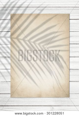 Vintage paper on a wooden background