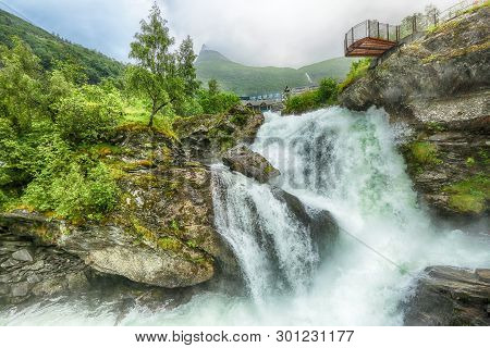 Waterfall In The Norwegian Town Geiranger Located On The Unesco-protected Geiranger Fjord