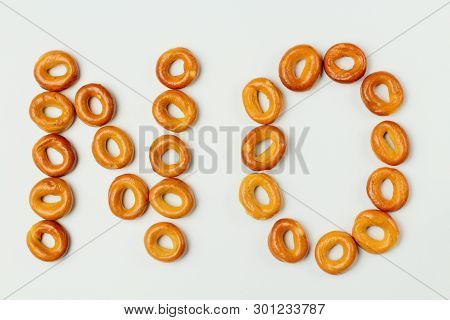 Concept: Word No Laid Out Of Bagels, On A White Background, High Contrast, Top View.