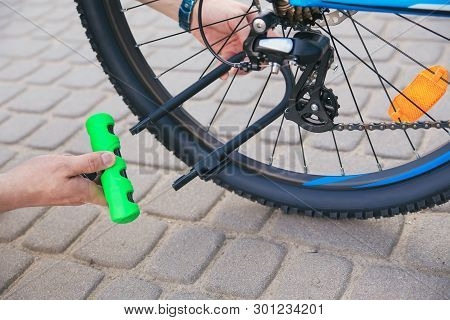Bicycle Lime Green U- Lock In Hands
