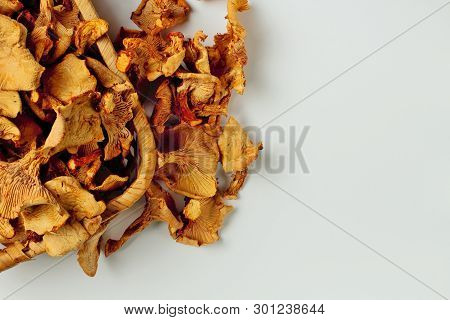 Dried Chanterelles In Wicker Goat On A White Background, Place Fot Text, Natural Color, High Contras