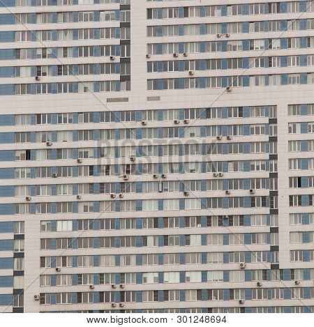 Facade Of An Apartment Building With Many Windows