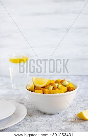 Pegan Salad With Mango, Avocado And Sweet Potatoes, Served With Lemon Water. Paleo Diet. Pegan Diet.