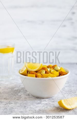 Pegan Salad With Mango, Avocado And Sweet Potatoes, Served With Lemon Water. Paleo Diet. Pegan Diet.