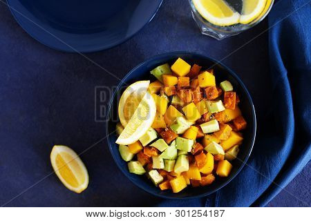 Pegan Salad With Mango, Avocado And Sweet Potatoes, Served With Lemon Water. Paleo Diet. Pegan Diet.