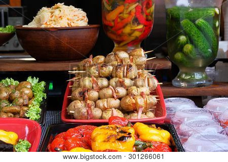 Potatoes With Lard And Bacon On Skewers In . Ukrainian National Cuisine. Traditional Food.