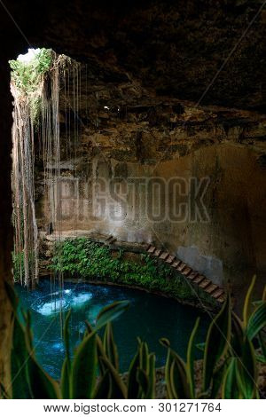 Cenote Ecoturistico Ik-kil With Blue Clear Water