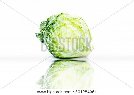 Raw Organic Cabbage Or Brassica Oleracea Var. Capitata Or Kale Isolated On White With Its Reflection