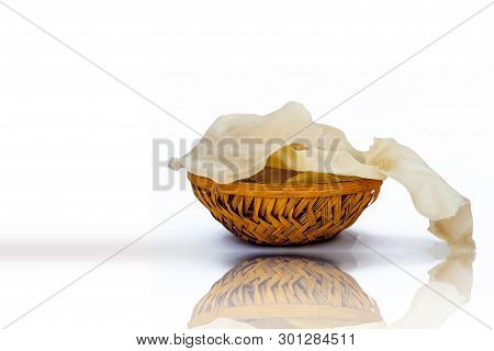 Papad Or Papadum In A Clay Bowl Isolated On White With Its Reflection.