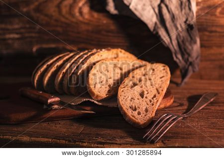 Rural Still Life With Homemade Bread On Rustic Background In The Morning Light