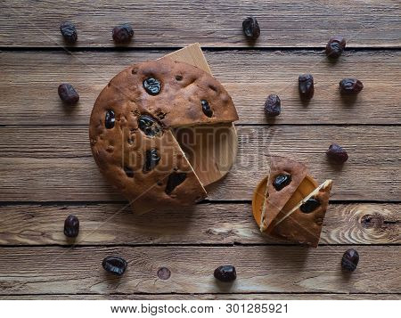 Honey And Date Cake On A White Wooden Background