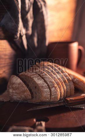 Rural Still Life With Homemade Bread On Rustic Background In The Morning Light