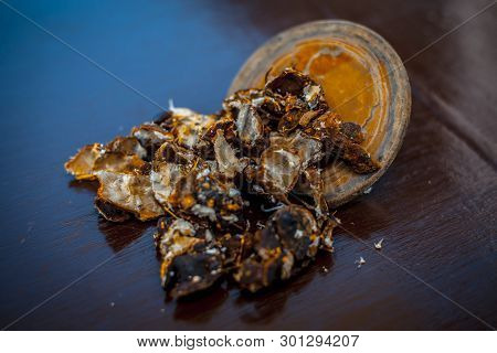 Raw Peeled Tamarind Or Imli In A Clay Bowl On Wooden Surface.