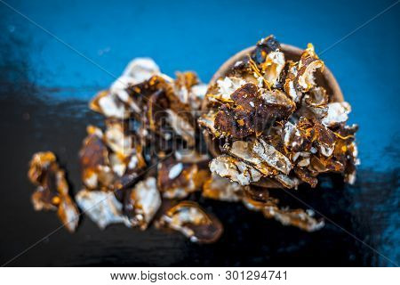 Raw Peeled Tamarind Or Imli In A Clay Bowl On Wooden Surface.