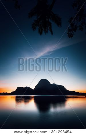 El Nido Silhouette Of Beautiful Cadlao Island In Dusk Light After Sunset In Palawan Island, Philippi