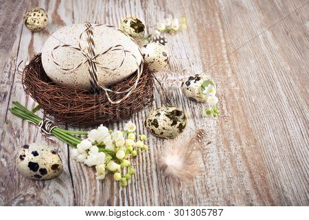 Bird's Nest, Eggs And Lily Of The Valley On Wood