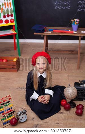 Back To School! A Girl In School Uniform Sitting In A Lesson. Schoolgirl Responds To The Lesson. On 