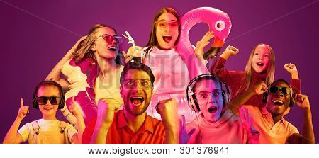 Beautiful Female And Male Models Isolated On Pink Neon Lights Studio Background. Astonished Woman An