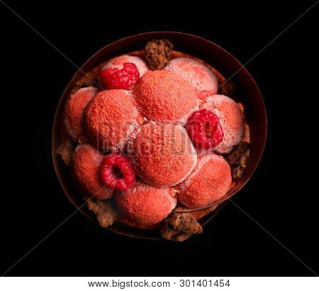 Big Red Raspberry Dessert With Fresh Raspberries And Textured Chocolate Glaze Close Up On Black Back