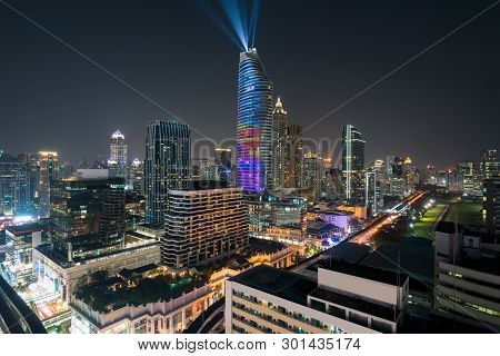 Night View With Skyscraper In Business District In Bangkok Thailand. Light Show At Magnolias Ratchap