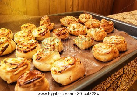 Freshly Baked Homemade Cinnamon Rolls Lie On A Baking Sheet