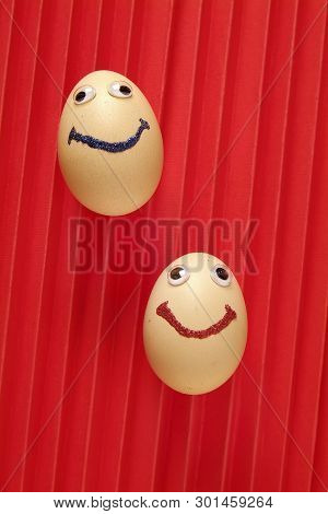 Eggs Isolated Over The Flour On Red Background
