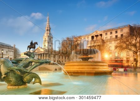 London, England - April 30, 2013: Fountain On The Trafalgar Square Early In The Evening With St. Mar