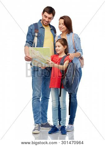 family, tourism and travel concept - happy smiling mother, father and little daughter with map and backpacks over white background