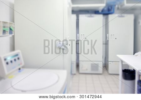 Scientific Background: Modern Laboratory Interior Out Of Focus, Text Space. This Is Blurred Image Wi