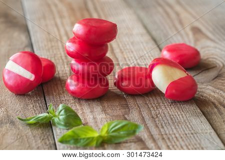 Small Snack Cheeses On The Wooden Board