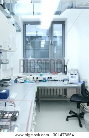 Interior Of Modern Research Biologial Or Chemical Laboratory Out Of Focus. This Is A Blurred Backgro