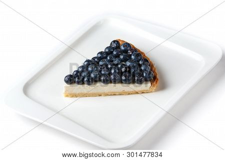 Piece Of Blueberry Pie In A White Plate On An Isolated White Background
