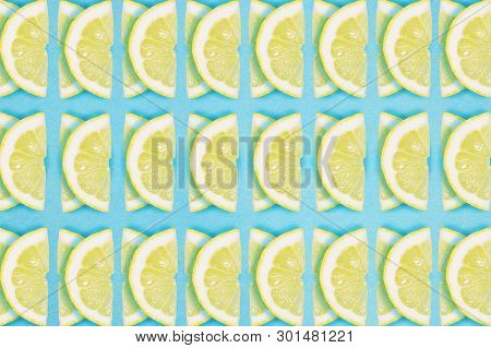 Bright Lemon Repeat Pattern On A Blue Background. Flat Lay Summer Concept.