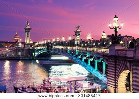 Alexandre Bridge In Paris At Night In Illumination, Toned Image.