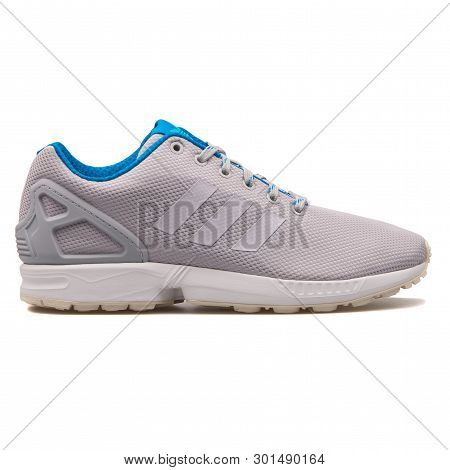Vienna, Austria - August 10, 2017: Adidas Zx Flux Grey And Blue Sneaker On White Background.