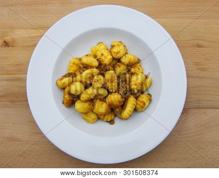 Homemade Potato Gnocchi With Bolognese Sauce (ragu) On A White Plate