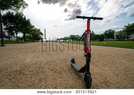 Washington Dc - May 9, 2019: A Dockless Shared App-based Electric Scooter By Jump From Uber Stands U