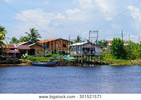 House On The River Shore With Jetty For Mooring Fishing Boats In Kuala Penyu,sabah Borneo,malaysia.k