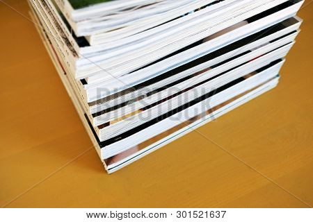 Pile Of Printed Magazines, Mass Media, Yellow Background