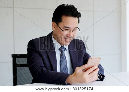 Asian Businessman Usiing Smart Phone At Office Background, Business People On Smart Phone, Business 