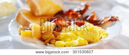 breakfast with eggs bacon and hashbrowns panorama