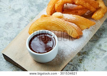 Churos Spanish Dessert. Gray Textured Background. Beautiful Serving Dishes. Dessert. Food Chain