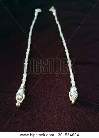 Indian Traditional Leg Wear Jewelry Payal Or Kandora On Violet Background