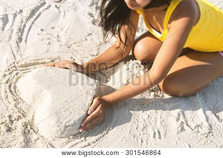 A Wonen Is Enjoying At The Beach.