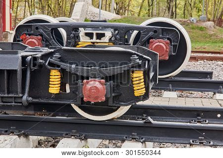 Railway Wheels Narrow Gauge Railway And Ordinary Railway. Freight Cargo Train Or Boxcar Chassis, Sus