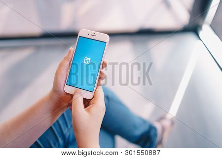 Chiang Mai, Thailand - Apr.08,2019: Woman Holding Apple Iphone 6s Rose Gold With Linkedin Applicatio