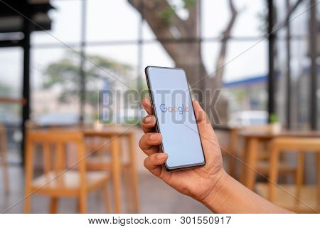 Chiang Mai, Thailand - Mar. 23,2019: Man Holding Xiaomi Mi Mix 3 With Google Search On Screen. Googl