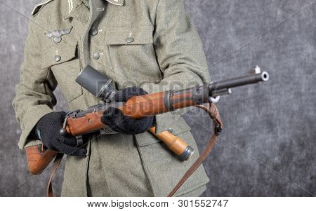 A Ww Ii German Soldier With Rifle And Grenade