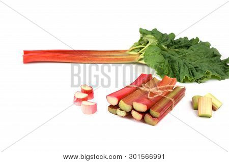 Rhubarb Isolated. Red Stalks , Bunch Of Cut Rhubarb  On White Background.fresh And Juicy Ready To Be